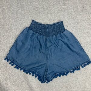 Blue Rain by Francesca’s high waisted blue shorts with Pom poms